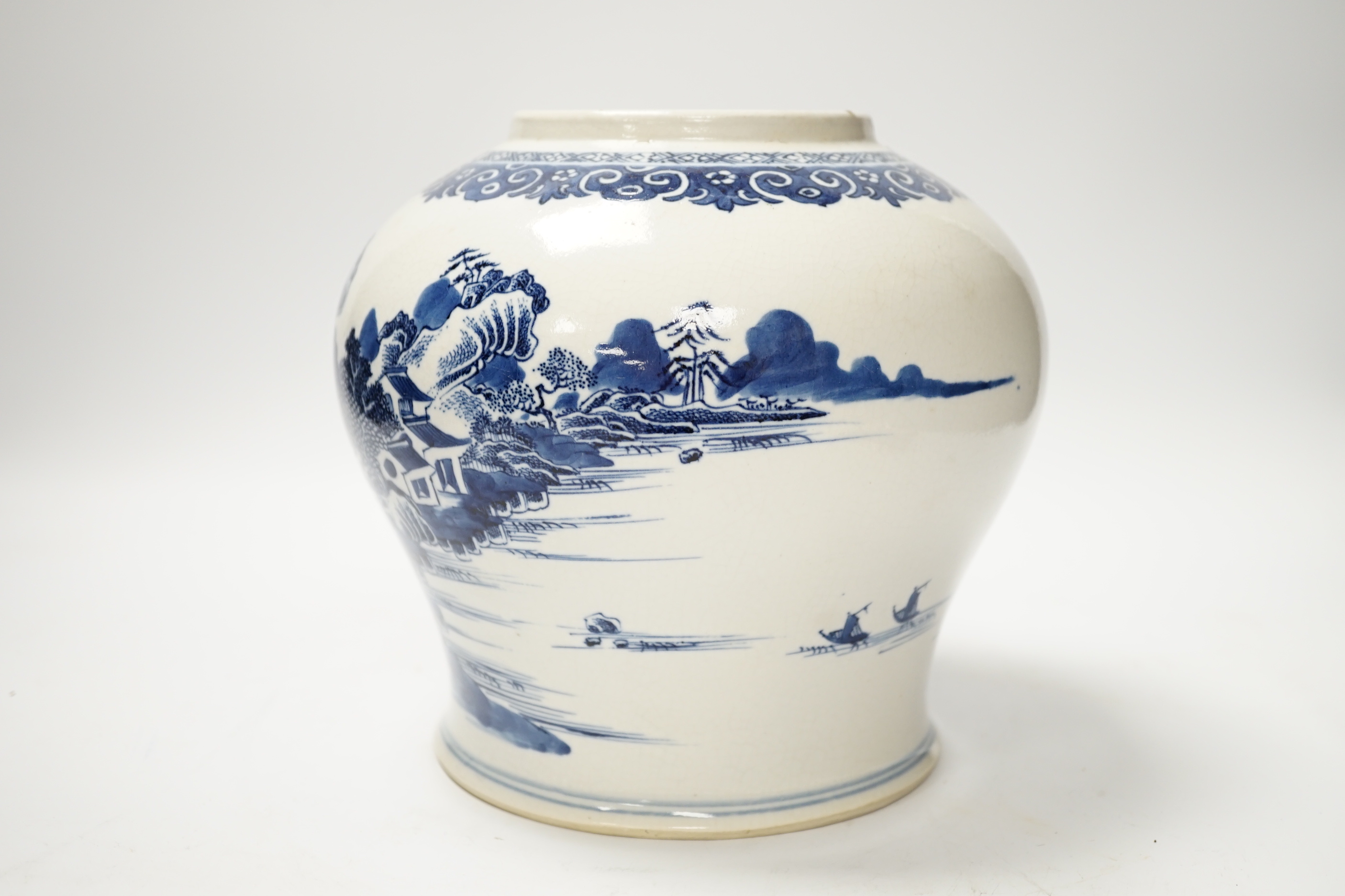 A Chinese Qianlong blue and white ‘soft paste’ porcelain landscape jar, 19cm high